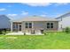 Spacious backyard with a patio, grill, and outdoor seating, perfect for entertaining or enjoying Gathering at 747 Gryffindor Dr., Longs, SC 29568