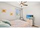 Comfortable bedroom featuring a ceiling fan, bed with decorative pillows, and a TV for relaxing entertainment at 747 Gryffindor Dr., Longs, SC 29568
