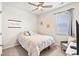 Cozy bedroom with plush carpeting, ceiling fan, and a comfortable bed with decorative pillows and floral comforter at 747 Gryffindor Dr., Longs, SC 29568