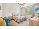 Relaxing bedroom featuring a comfortable bed, soft lighting, and a large window at 747 Gryffindor Dr., Longs, SC 29568