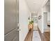 Bright hallway with wood floors, leading to a living area, and showcasing stylish decor at 747 Gryffindor Dr., Longs, SC 29568