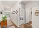 Hallway with wood floors leading to the bedroom and living room, decorated with wall art at 747 Gryffindor Dr., Longs, SC 29568