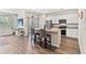 Open kitchen with a breakfast bar, stainless steel appliances, and easy access to the living area at 747 Gryffindor Dr., Longs, SC 29568