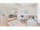 Spacious living room with a large sectional sofa, ceiling fan, and dining area at 747 Gryffindor Dr., Longs, SC 29568