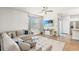 Comfortable living room with a sectional, ceiling fan, and entertainment center at 747 Gryffindor Dr., Longs, SC 29568