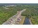 A neighborhood aerial showcasing community pond, community pool, and landscaping at 847 Flowering Branch Ave., Little River, SC 29566