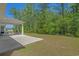 Large backyard with patio and ample green space for outdoor activities at 847 Flowering Branch Ave., Little River, SC 29566