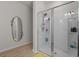 Modern bathroom with a sleek glass-enclosed shower and neutral decor at 847 Flowering Branch Ave., Little River, SC 29566