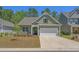 Charming one-story home with a well-manicured lawn, a two-car garage, and beautiful curb appeal at 847 Flowering Branch Ave., Little River, SC 29566