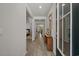 Bright hallway featuring durable floors, neutral paint, and a clear view of other rooms at 847 Flowering Branch Ave., Little River, SC 29566