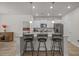 Bright kitchen featuring granite countertops, stainless appliances, barstool seating, and plenty of cabinet space at 847 Flowering Branch Ave., Little River, SC 29566