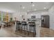 Bright kitchen featuring granite countertops, stainless appliances, barstool seating, and plenty of cabinet space at 847 Flowering Branch Ave., Little River, SC 29566
