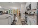 Well-equipped kitchen with granite countertops, stainless steel appliances, and stylish backsplash at 847 Flowering Branch Ave., Little River, SC 29566
