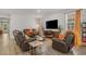 Spacious living room with a fireplace, large windows, and a cozy atmosphere at 847 Flowering Branch Ave., Little River, SC 29566
