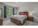 Spacious main bedroom with a large bed, storage drawers, and bedside lamps at 847 Flowering Branch Ave., Little River, SC 29566
