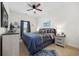 Bedroom features a ceiling fan, window and comfortable bed with nightstands at 903 Ocean Pines Ct., North Myrtle Beach, SC 29582