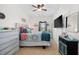 Bright bedroom featuring a ceiling fan, a comfortable bed and dresser at 903 Ocean Pines Ct., North Myrtle Beach, SC 29582