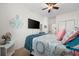 Bright bedroom featuring a ceiling fan, a comfortable bed, and flatscreen TV at 903 Ocean Pines Ct., North Myrtle Beach, SC 29582