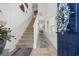 Bright entryway with staircase, stylish decor, and tiled floors, leading into the home at 903 Ocean Pines Ct., North Myrtle Beach, SC 29582
