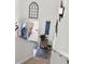 Welcoming entryway with staircase and stylish decor, including a blue front door at 903 Ocean Pines Ct., North Myrtle Beach, SC 29582