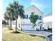 Charming two-story home with palm trees, a two-car garage and lovely curb appeal at 903 Ocean Pines Ct., North Myrtle Beach, SC 29582