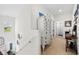 Bright hallway with a white dresser and view of bathroom, offering ample storage at 903 Ocean Pines Ct., North Myrtle Beach, SC 29582
