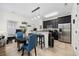Bright kitchen with black cabinets, stainless appliances, and bar seating flowing into the living area at 903 Ocean Pines Ct., North Myrtle Beach, SC 29582