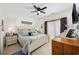 Relaxing main bedroom featuring a large bed, dresser, and a ceiling fan at 903 Ocean Pines Ct., North Myrtle Beach, SC 29582