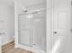 Modern bathroom featuring a glass shower with white tile surround and door at 9616 Sullivan Dr., Murrells Inlet, SC 29576