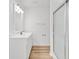 Bathroom featuring glass shower, modern vanity, and hardwood floors at 9616 Sullivan Dr., Murrells Inlet, SC 29576