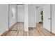 Bedroom with sliding mirror closet doors and an adjacent doorway at 9616 Sullivan Dr., Murrells Inlet, SC 29576