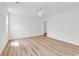 Clean bedroom with hardwood floors, large window, and bright walls at 9616 Sullivan Dr., Murrells Inlet, SC 29576