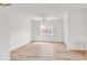 Bright bedroom featuring light wood-look floors, a ceiling fan and a large double window at 9616 Sullivan Dr., Murrells Inlet, SC 29576