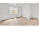 Bright bedroom with hardwood floors, large window, and spacious closet at 9616 Sullivan Dr., Murrells Inlet, SC 29576