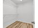 Walk-in closet with wire shelving and hardwood floors at 9616 Sullivan Dr., Murrells Inlet, SC 29576