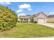 Charming single Gathering home with a well-maintained lawn and attached one car garage at 9616 Sullivan Dr., Murrells Inlet, SC 29576
