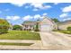 Charming single Gathering home with a well-maintained lawn and attached one car garage at 9616 Sullivan Dr., Murrells Inlet, SC 29576