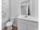 Bathroom features a tub, toilet, vinyl floor, and vanity with white countertops at 1011 Laconic Dr., Myrtle Beach, SC 29588