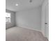 Bedroom features neutral carpet, light gray walls and a bright window at 1011 Laconic Dr., Myrtle Beach, SC 29588