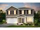 Two-story home featuring board and batten siding, black shutters, and a two-car garage at 1011 Laconic Dr., Myrtle Beach, SC 29588