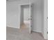 Open door in a hallway featuring neutral carpet and paint at 1011 Laconic Dr., Myrtle Beach, SC 29588