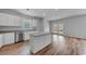 Open kitchen with white cabinets, granite countertops, stainless steel appliances, and island at 1011 Laconic Dr., Myrtle Beach, SC 29588