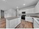 Modern kitchen featuring white cabinets, stainless steel appliances, and a kitchen island at 1011 Laconic Dr., Myrtle Beach, SC 29588
