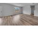 Living room featuring wood-look flooring, neutral paint, and a window at 1011 Laconic Dr., Myrtle Beach, SC 29588