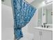 Clean bathroom with a modern vanity, updated fixtures, and a tub with a shower at 1011 S Ocean Blvd. # 202, North Myrtle Beach, SC 29582