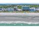 Stunning beachfront view featuring modern condominiums and the beautiful shoreline and the beach at 1011 S Ocean Blvd. # 202, North Myrtle Beach, SC 29582