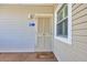 Inviting entrance featuring a charming door with a 'hello' welcome mat outside the unit at 1011 S Ocean Blvd. # 202, North Myrtle Beach, SC 29582