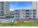 Exterior of a building featuring pools and balconies at 1011 S Ocean Blvd. # 202, North Myrtle Beach, SC 29582