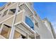 Low angle shows Palmetto Dunes signage on a light cream sided building under blue sky at 1011 S Ocean Blvd. # 202, North Myrtle Beach, SC 29582
