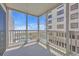 Relaxing screened porch with views of the pool, beach, and ocean beyond at 1011 S Ocean Blvd. # 202, North Myrtle Beach, SC 29582